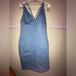 Light blue/turquoise dress with straps and back slit.